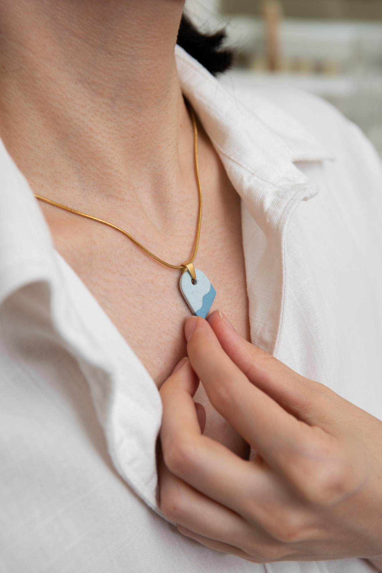 Handmade Jewelry Maleni Atelier Blue asymmetric wave necklace with cinnamon